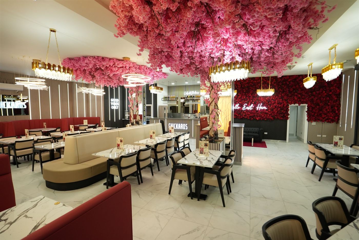 Chickaros dine-in interior with rose wall